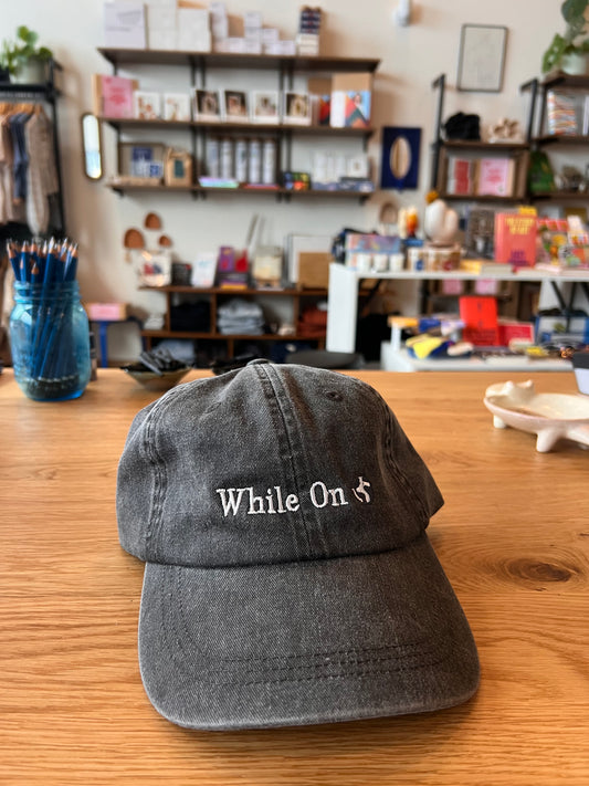 While on Earth - Globe Dad Hat