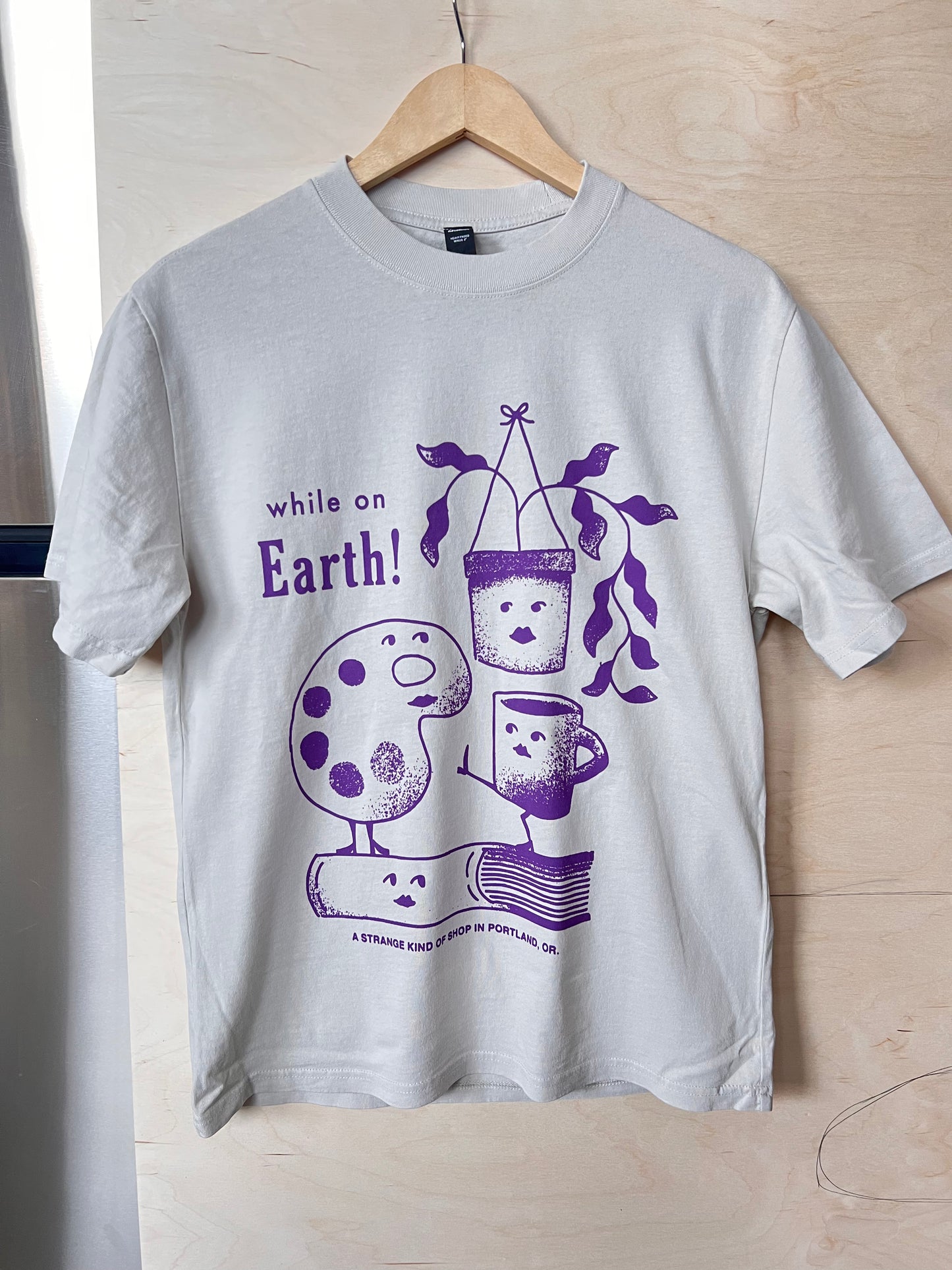 While on Earth Strange Tee