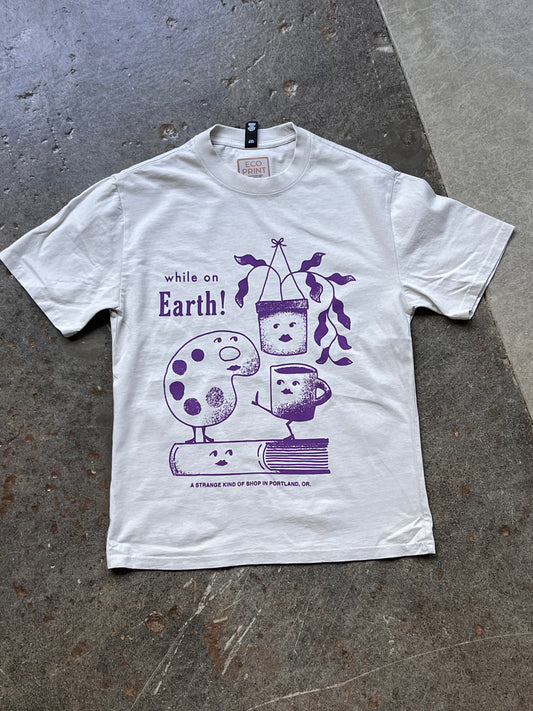 While on Earth Strange Tee