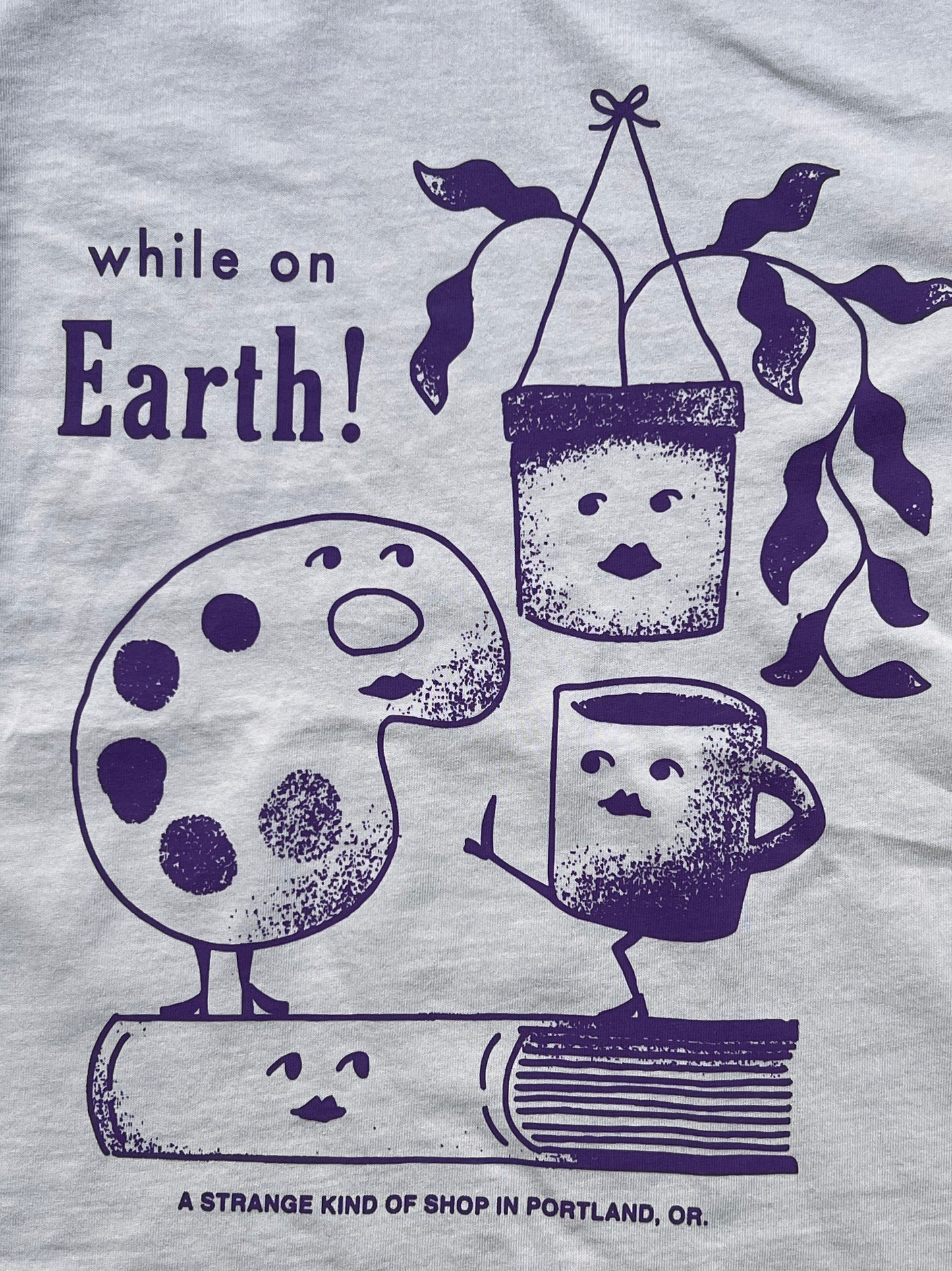 While on Earth Strange Tee