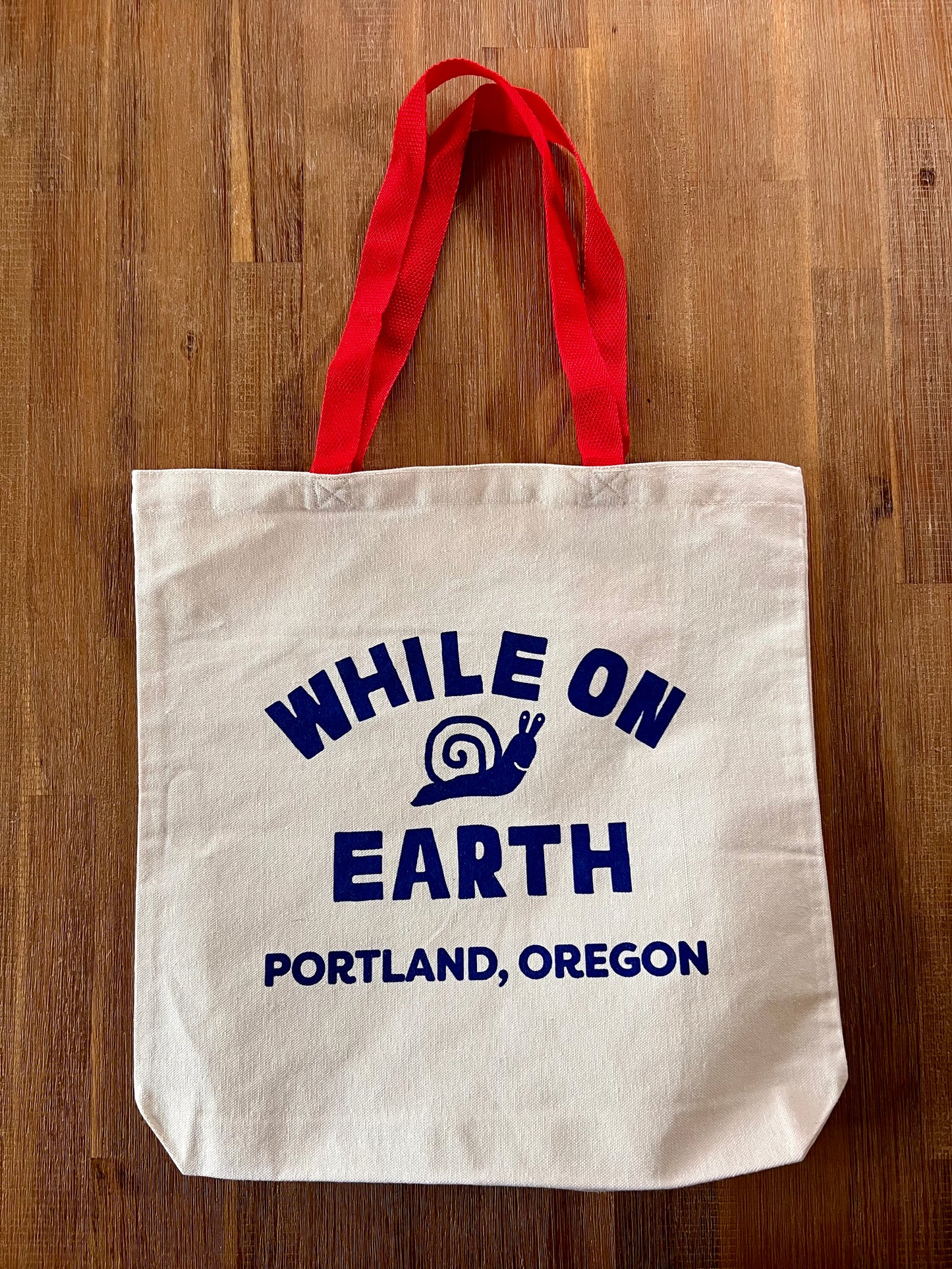 While on Earth Canvas Tote