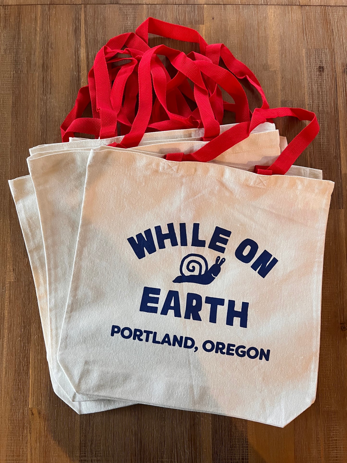 While on Earth Canvas Tote