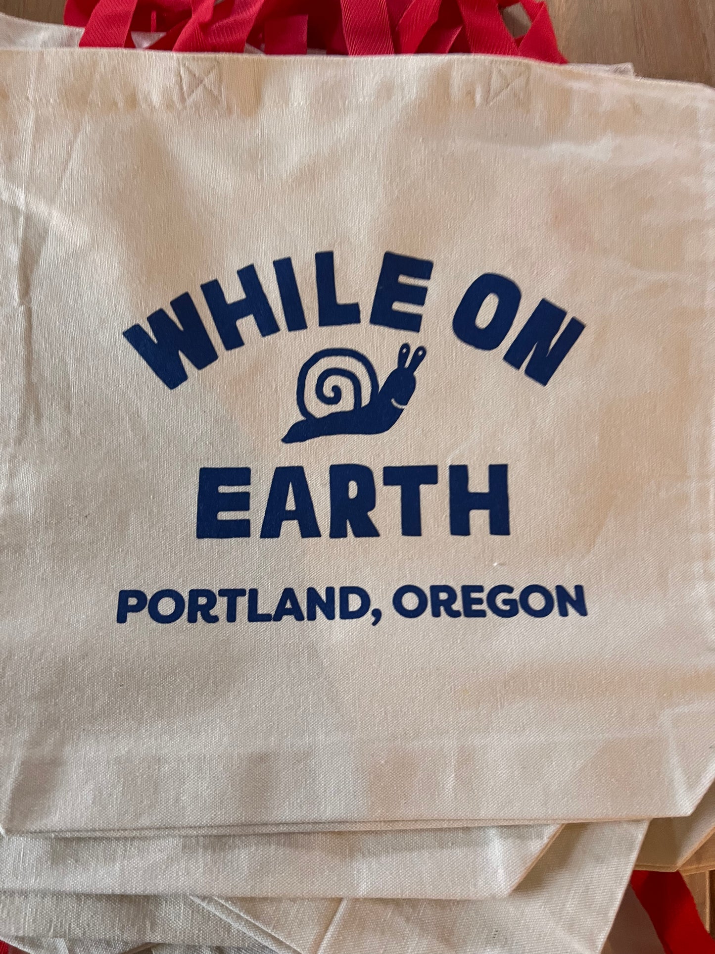 While on Earth Canvas Tote